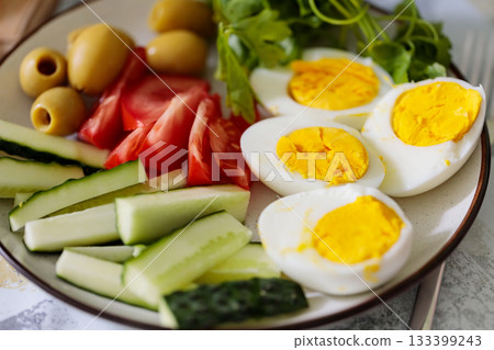 Boiled Eggs and Fresh Vegetables Healthy Breakfast Plate 133399243
