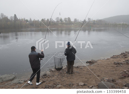 fishers with a fish fishers with a fish 133399458