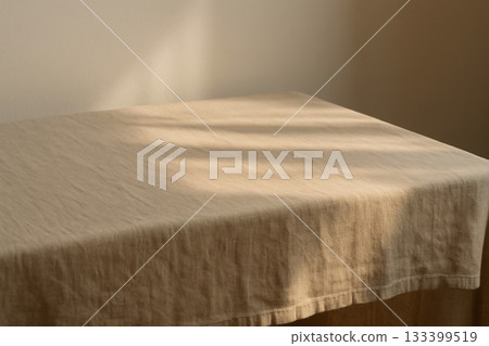 The texture of linen gently enveloped in the afternoon light The texture of linen gently enveloped in the afternoon light 133399519
