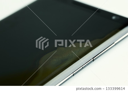 A close view of a smartphone screen showing signs of wear. A close view of a smartphone screen showing signs of wear. 133399614