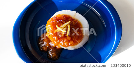 Steamed daikon radish served on a plate 133400010