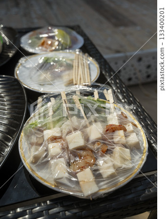 street food under transparent packaging on the street on the table street food under transparent packaging on the street on the table 133400201