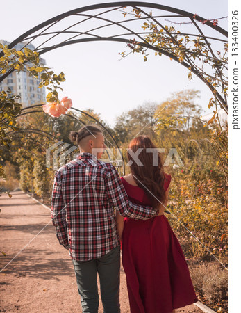 young couple in love walking and having fun in autumn park 133400326