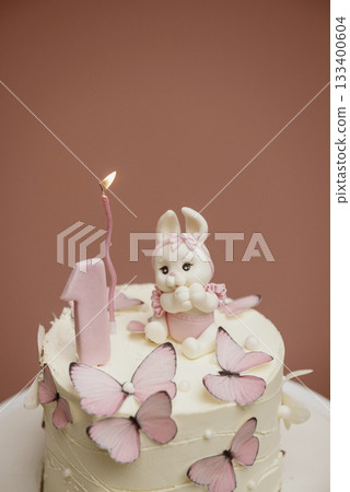 White and pink cake with cute bunny for children's birthday  133400604
