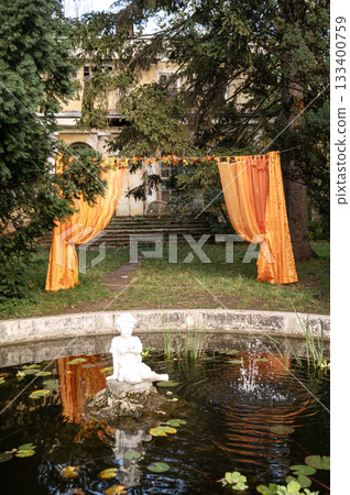 fountain in the form of an angel sitting in water, 19th century. 133400759