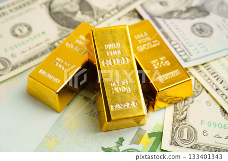 Gold bars with US dollar and Euro banknote money, finance trading investment business currency concept. 133401343