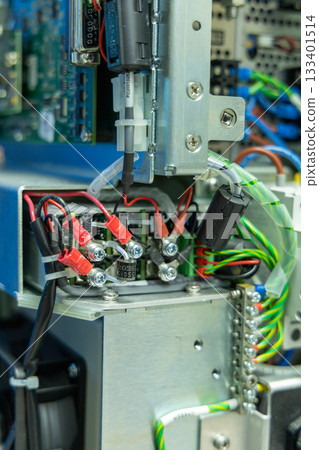 Man's hand repairing an electronic board 133401514