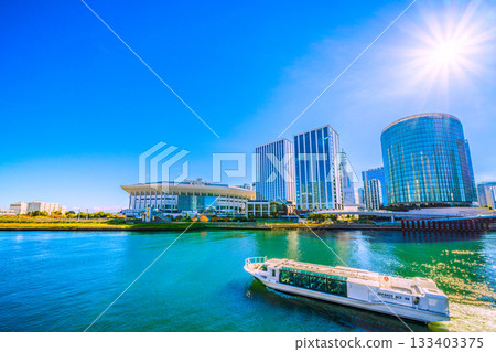 Yokohama cityscape in Japan: View of the bustling K Arena, Hilton Yokohama, Yokohama Landmark Tower, water buses, and more 133403375