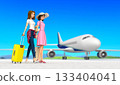 Two smiling women traveling. 133404041