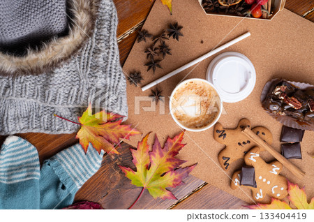 autumn cozy and warm composition with coffee at wooden table with leaves. life style concept. flat lay 133404419