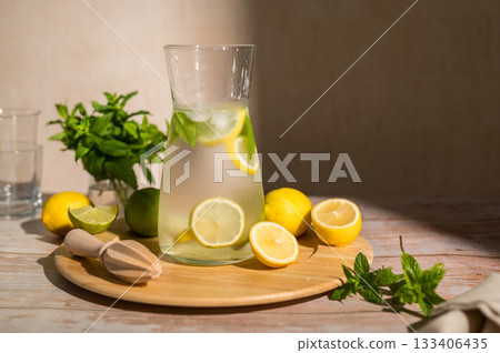 Lemonade with lemons, limes and fresh mint. Refreshing, homemade lemonade. Copy space 133406435