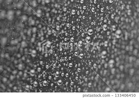 Rain drops on the glass dark moody texture background Rain drops on the glass dark moody texture background 133406450