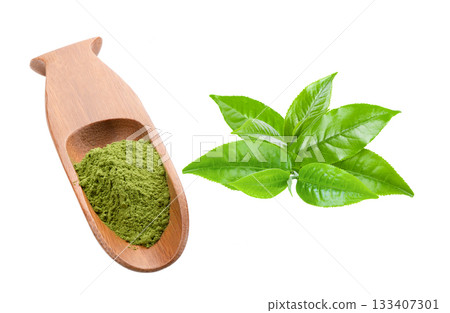 matcha green tea powder in wood spoon with leaves isolated on white background matcha green tea powder in wood spoon with leaves isolated on white background 133407301