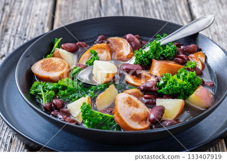Red kidney bean, potato, kale and sausage soup 133407919
