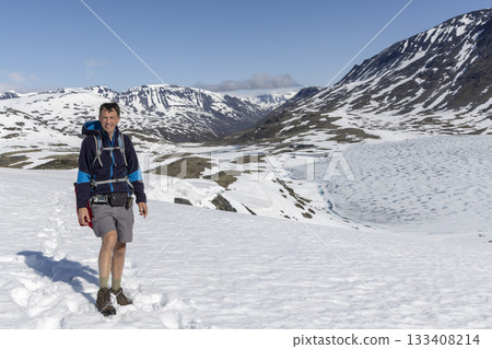 Exploring the snowy landscape of Leirvassbu in Leirdalen, Jotunheimen National Park during clear weather 133408214