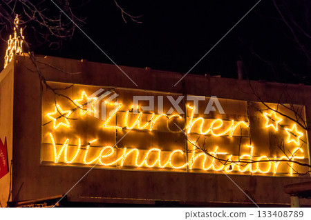 Christmas market welcome sign in Zurich, Switzerland. "Zurich Christmas village" written on sign in German Christmas market welcome sign in Zurich, Switzerland. "Zurich Christmas village" written on sign in German 133408789