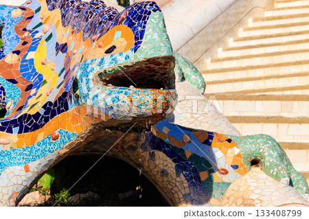 Multicolored mosaic dragon salamander of Gaudi in Park Guell, Barcelona, Spain 133408799