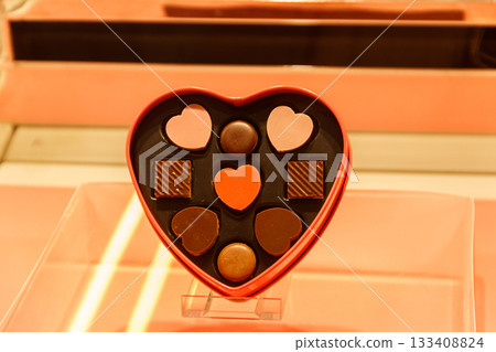 Heart shaped box of chocolate candies. Valentine Day concept Heart shaped box of chocolate candies. Valentine Day concept 133408824