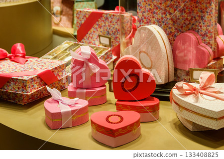 Heart shaped gift boxes on a store display. Valentine Day concept Heart shaped gift boxes on a store display. Valentine Day concept 133408825