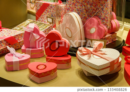 Heart shaped gift boxes on a store display. Valentine Day concept Heart shaped gift boxes on a store display. Valentine Day concept 133408826