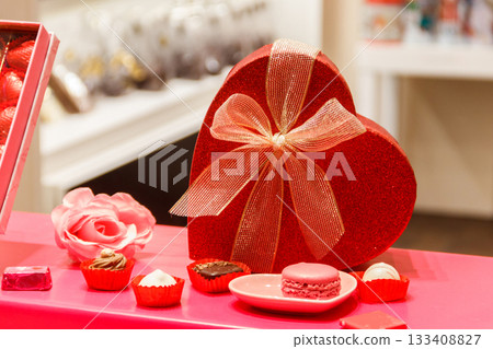Heart shaped gift box on a store display. Valentine Day concept Heart shaped gift box on a store display. Valentine Day concept 133408827