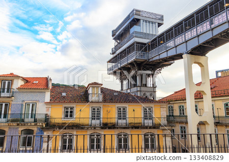 Santa Justa lift in Lisbon, Portugal. Famous landmark and entertaining tourist attraction with viewing platform upstairs 133408829