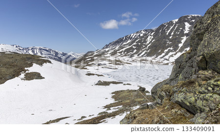 Snow-covered landscape at Leirvassbu in Leirdalen showcasing the beauty of Jotunheimen National Park 133409091