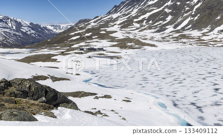 Breathtaking snowy landscape at Leirvassbu in Jotunheimen National Park showcases nature's winter beauty 133409112