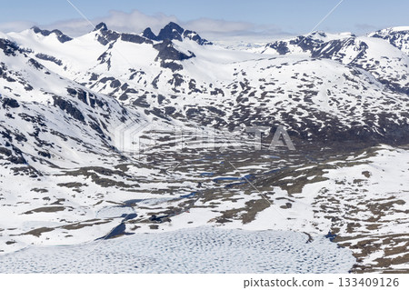 Snowy landscape in Leirvassbu showcasing the beauty of Leirdalen in Jotunheimen National Park during winter. View from Kyrkja mountain. 133409126