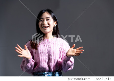 Young woman speaking under the spotlight 133410618