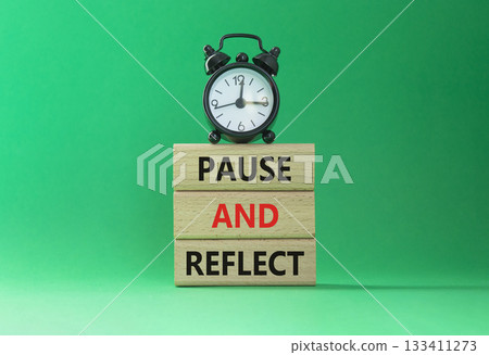 Pause and Reflect symbol. Concept words Pause and Reflect on wooden blocks. Beautiful green background with alarm clock. Business and Pause and Reflect concept. Copy space. Pause and Reflect symbol. Concept words Pause and Reflect on wooden blocks. Beautiful green background with alarm clock. Business and Pause and Reflect concept. Copy space. 133411273