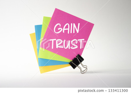 Gain trust symbol. Gain trust on sticky note. Beautiful white background. Business and Gain trust concept. Copy space. Gain trust symbol. Gain trust on sticky note. Beautiful white background. Business and Gain trust concept. Copy space. 133411300