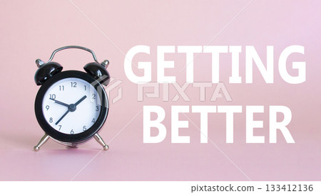 Getting better symbol. Beautiful pink background with alarm clock. Business and Getting better concept. Copy space. 133412136