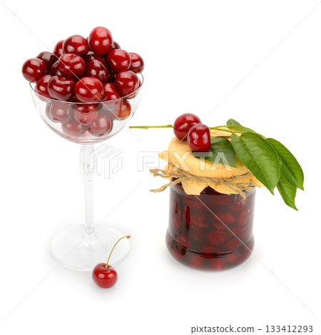 Fresh cherries in glass and preserved jam in jar with twine lid, isolated on white, studio food arrangement Fresh cherries in glass and preserved jam in jar with twine lid, isolated on white, studio food arrangement 133412293