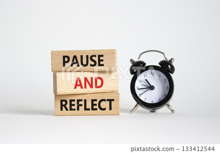 Pause and Reflect symbol. Concept words Pause and Reflect on wooden blocks. Beautiful white background with alarm clock. Business and Pause and Reflect concept. Copy space. Pause and Reflect symbol. Concept words Pause and Reflect on wooden blocks. Beautiful white background with alarm clock. Business and Pause and Reflect concept. Copy space. 133412544