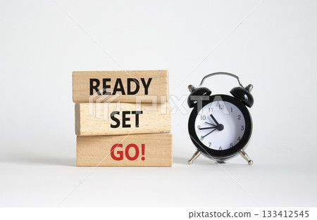 Ready Set Go symbol. Concept words Ready Set Go on wooden blocks. Beautiful white background with alarm clock. Business and Ready Set Go concept. Copy space. Ready Set Go symbol. Concept words Ready Set Go on wooden blocks. Beautiful white background with alarm clock. Business and Ready Set Go concept. Copy space. 133412545