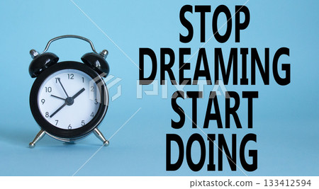 Stop Dreaming Start Doing symbol. Beautiful blue background with alarm clock. Business and Stop Dreaming Start Doing concept. Copy space. Stop Dreaming Start Doing symbol. Beautiful blue background with alarm clock. Business and Stop Dreaming Start Doing concept. Copy space. 133412594