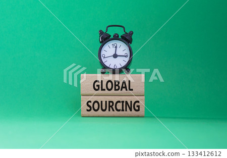 Global Sourcing symbol. Wooden blocks with words Global Sourcing. Beautiful green background with alarm clock. Business and Global Sourcing concept. Copy space. 133412612