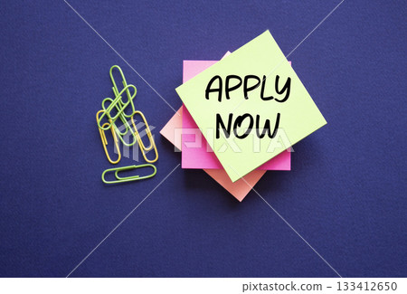 Apply now symbol. Concept word Apply now on sticky note. Beautiful deep blue background. Business and Apply now concept. Copy space Apply now symbol. Concept word Apply now on sticky note. Beautiful deep blue background. Business and Apply now concept. Copy space 133412650