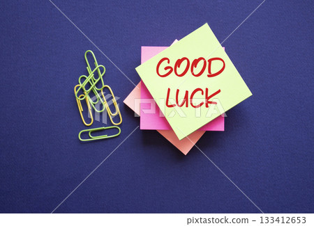 Good luck symbol. Good luck on sticky note. Beautiful deep blue background. Business and Good luck concept. Copy space. 133412653