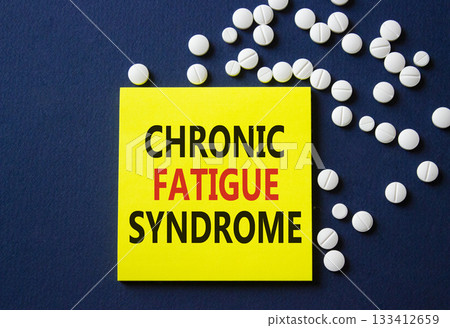 Chronic Fatigue Syndrome symbol. Concept word Chronic Fatigue Syndrome on yellow note. Beautiful deep blue background with pills. Medicine and Chronic Fatigue Syndrome concept. Copy space Chronic Fatigue Syndrome symbol. Concept word Chronic Fatigue Syndrome on yellow note. Beautiful deep blue background with pills. Medicine and Chronic Fatigue Syndrome concept. Copy space 133412659
