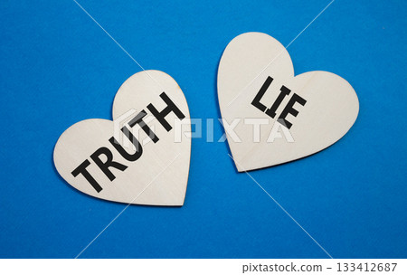 Truth or Lie symbol. Concept word Truth or Lie on wooden hearts. Beautiful blue background. Business and Truth or Lie concept. Copy space Truth or Lie symbol. Concept word Truth or Lie on wooden hearts. Beautiful blue background. Business and Truth or Lie concept. Copy space 133412687