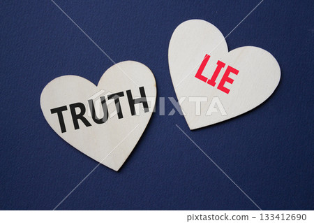 Truth or Lie symbol. Concept word Truth or Lie on wooden hearts. Beautiful deep blue background. Business and Truth or Lie concept. Copy space Truth or Lie symbol. Concept word Truth or Lie on wooden hearts. Beautiful deep blue background. Business and Truth or Lie concept. Copy space 133412690