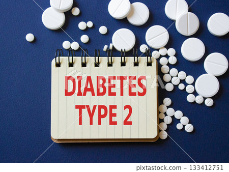 Diabetes Type 2 symbol. Concept word Diabetes Type 2 on notebook. Beautiful deep blue background with pills. Medicine and Diabetes Type 2 concept. Copy space 133412751