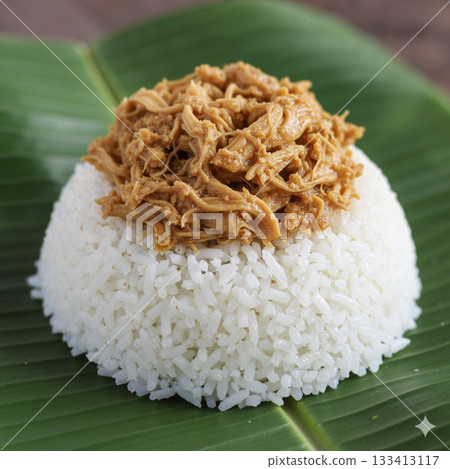 The image shows Chicken Pastil, a traditional Filipino dish popular in the Mindanao region The image shows Chicken Pastil, a traditional Filipino dish popular in the Mindanao region 133413117