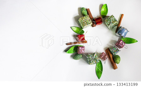 New Year's composition of gifts and various decorations in the form of a wreath. Christmas decor. New Year's composition of gifts and various decorations in the form of a wreath. Christmas decor. 133413199