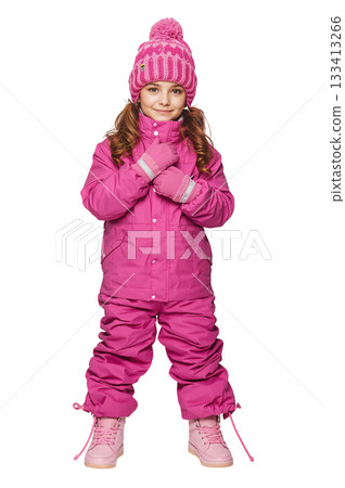 Cute Girl in Pink Winter Outfit Ready for Snow Fun Outside in Winter Sunlight 133413266