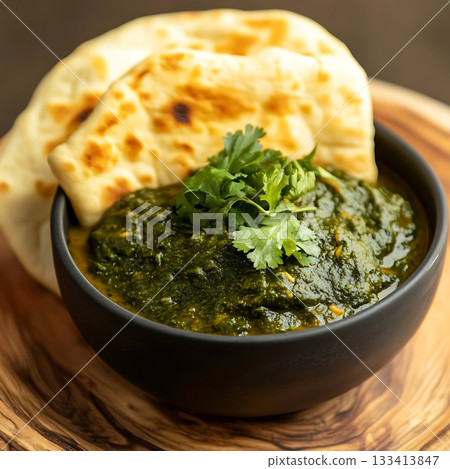 Delicious Palak Paneer with Naan Garnished with Fresh Coriander 133413847