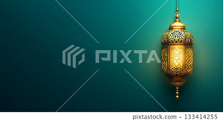 Golden lantern shining against a teal backdrop with soft glow 133414255