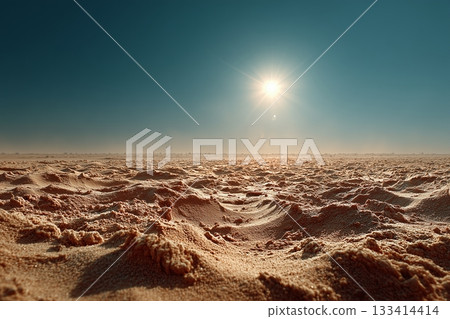 Stunning desert landscape under a bright sun, showcasing warm sand and clear blue sky. 133414414